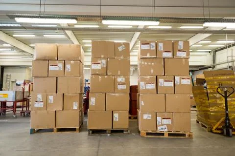 Package boxes for delivery in the DHL storehouse Stock Photos