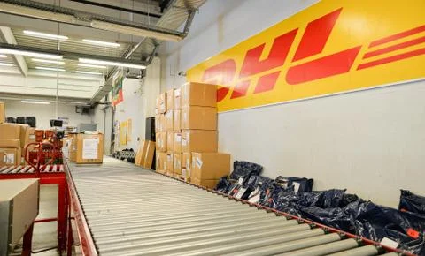 Package boxes for delivery in the DHL storehouse Stock Photos