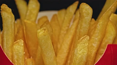 Package, brown bag made of eco material with fries, salt is poured on top Stock Footage 140016507