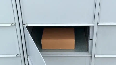 Package delivery in residential parcel locker box Stock Footage 330125946
