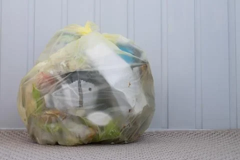 Package with household garbage Stock Photos