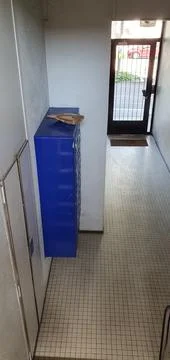 Package left on top of the mail boxes in an apartment building Stock Photos