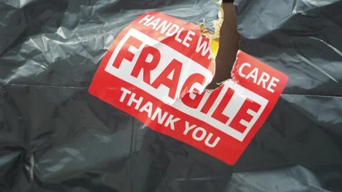 A package marked with warnings fragile  arrived damage, Stock Footage 317360672