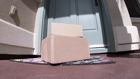 Package on mat outside door which opens and man picks up Stock Footage 120812428