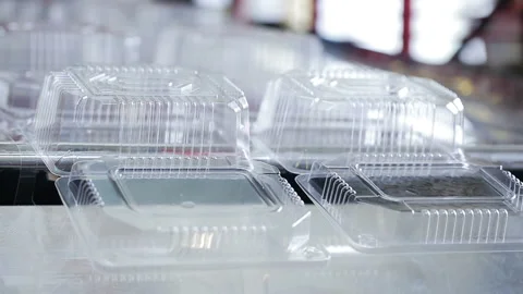 Package for pack salad and hot food. Goods manufactured of plastic packaging fro Stock Footage 199487351