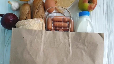 Package paper milk bread cheese on a wooden background Video stock 86693979