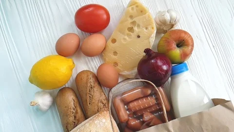 Package paper milk bread cheese on a wooden background Stock Footage 86694038