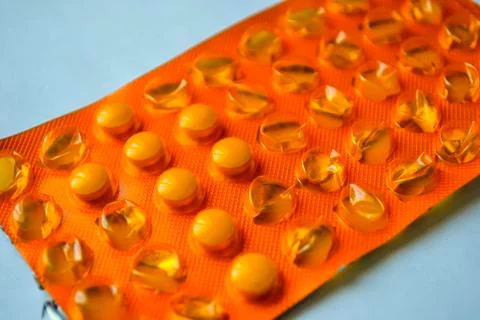 A package started tablets lying on the table Stock Photos