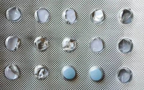 A package started tablets lying on the table Stock Photos
