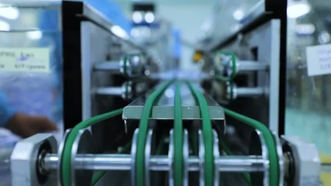 A package of syringes falls off the conveyor Stock Footage 163088101