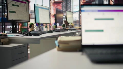 Package tracking software and spreadsheets displayed on PC screens in office Stock Footage 305387764
