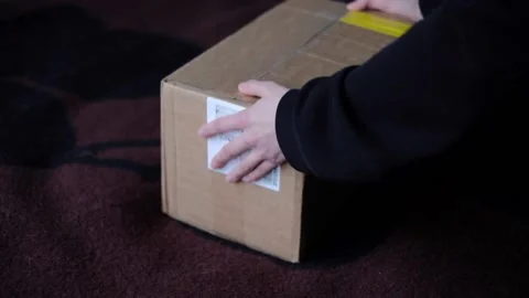 Package unwrapping Video stock 233512879