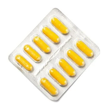 Package of yellow capsules Foto stock