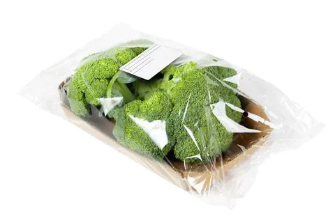 Packaged and labeled broccoli on an isolated white background 스톡 사진