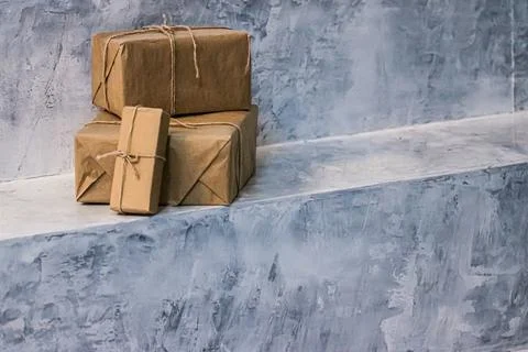 Packaged boxes for postal delivery service, parcels wrapped in brown paper and 스톡 사진
