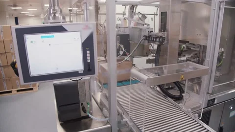 Packaged carton box moving on conveyor belt in the workshop of production Stock Footage 200857046