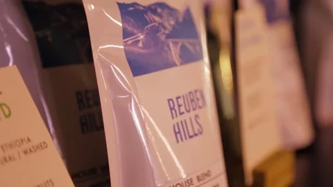 Packaged Coffee Bags Arranged on Shelf in Sydney Cafe Setting, Australia Stock Footage 345691553