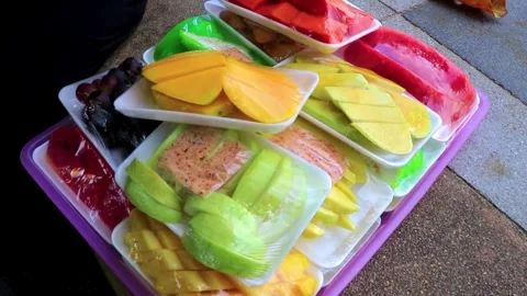 Packaged colorful cut fruit watermelon papaya mango in Pattaya Thailand. Stock Footage 315029267