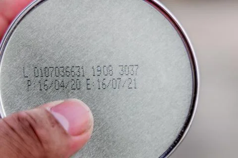 Packaged Date and Expire Date information on the bottom of the canned frozen  Stock Photos