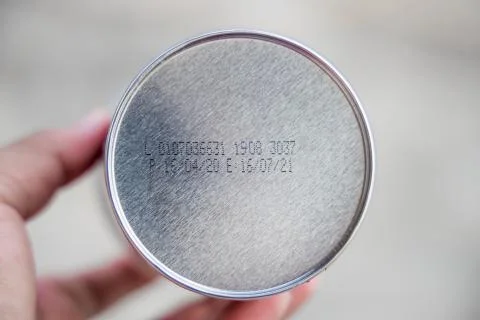 Packaged Date and Expire Date information on the bottom of the canned frozen  Stock Photos