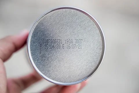 Packaged Date and Expire Date information on the bottom of the canned frozen  Stock Photos