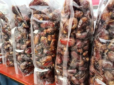 Packaged dates sold on the market. Stock Photos