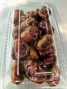 Packaged dates sold on the market. Stock Photos