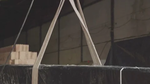 Packaged goods cling to the hanging hook of the crane Video stock 73731023