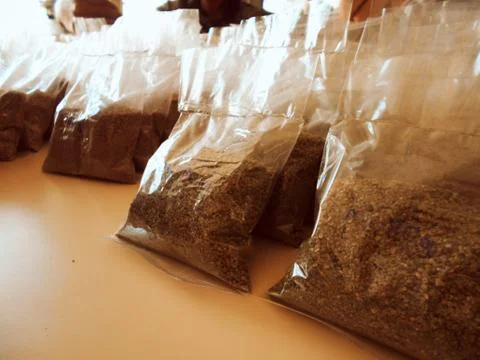 Packaged granulated inputs waiting for labeling Stock Photos