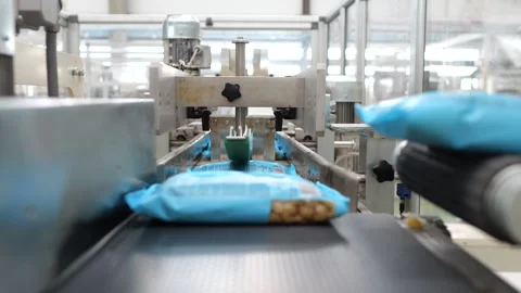 Packaged macrons in packs move along the conveyor. Stock Footage 277923221