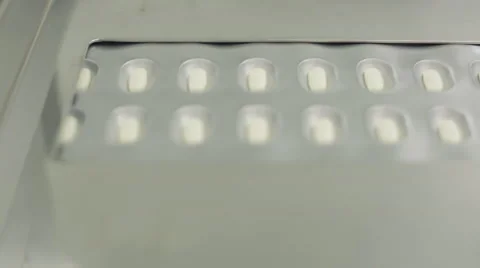 Packaged Pills Moving Along Conveyor Belt Stock Footage 68642964