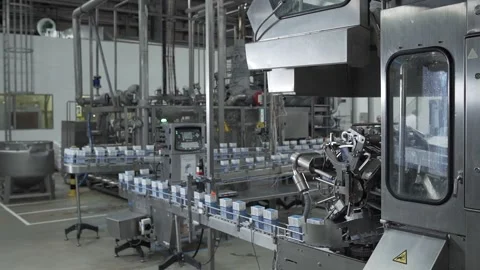 Packaged products moving along the conveyor wide shot Video stock 130356859