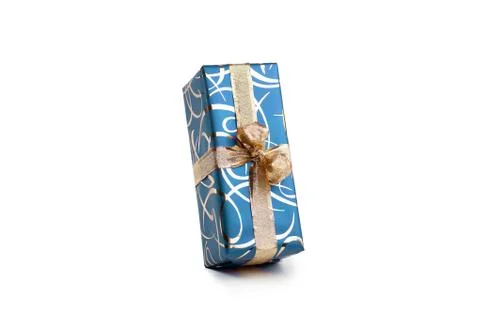 Packaged rectangular gift in blue packaging with gold bow and gold pattern on a Stock Photos