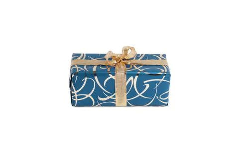 Packaged rectangular gift in blue packaging with gold bow and gold pattern on a Foto stock