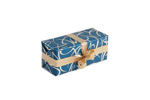 Packaged rectangular gift in blue packaging with gold bow and gold pattern on a Stock Photos