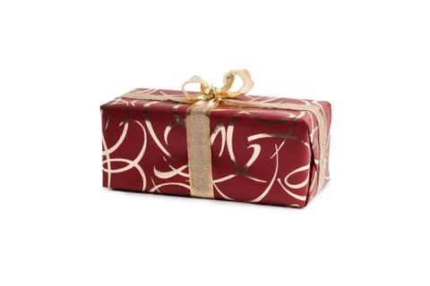 Packaged rectangular gift in burgundy packaging with gold bow and gold pattern Stock Photos