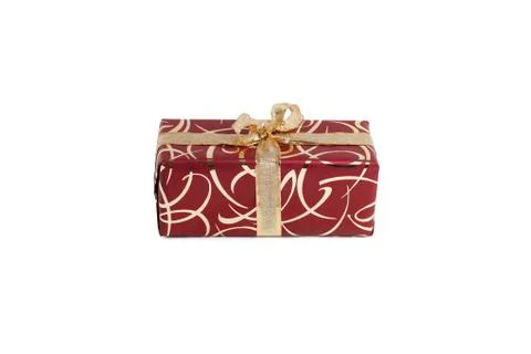 Packaged rectangular gift in burgundy packaging with gold bow and gold pattern Stock Photos