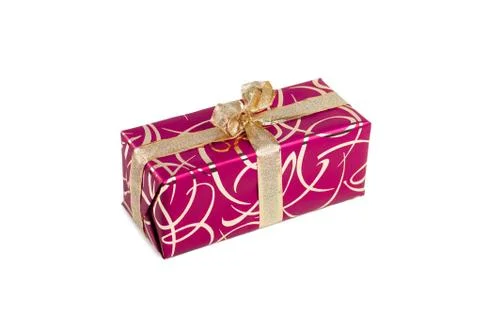 Packaged rectangular gift in dark pink packaging with gold bow and gold pattern Stock Photos