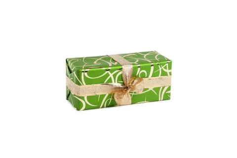 Packaged rectangular gift in green packaging with gold bow and gold pattern on a Stock Photos