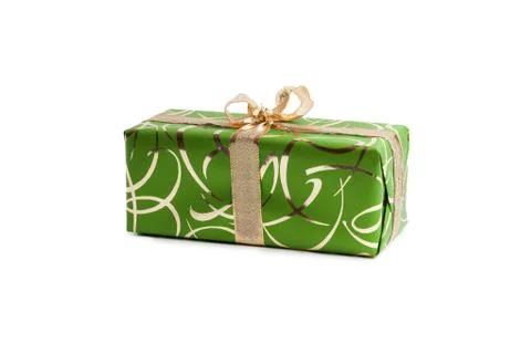 Packaged rectangular gift in green packaging with gold bow and gold pattern on a Stock Photos