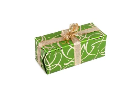 Packaged rectangular gift in green packaging with gold bow and gold pattern on a Foto stock