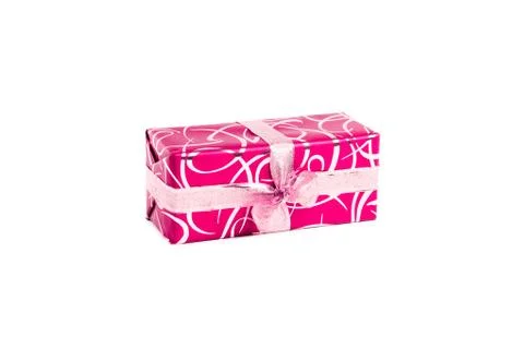 Packaged rectangular gift in pink packaging with gold bow and gold pattern on a Stock Photos