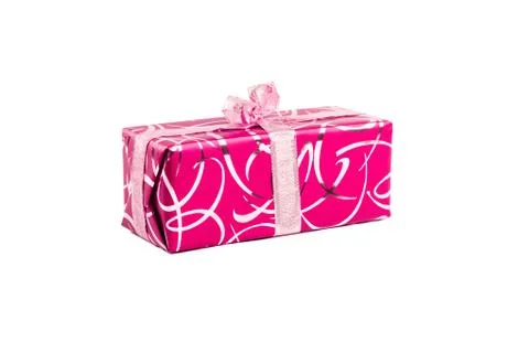Packaged rectangular gift in pink packaging with gold bow and gold pattern on a Stock Photos