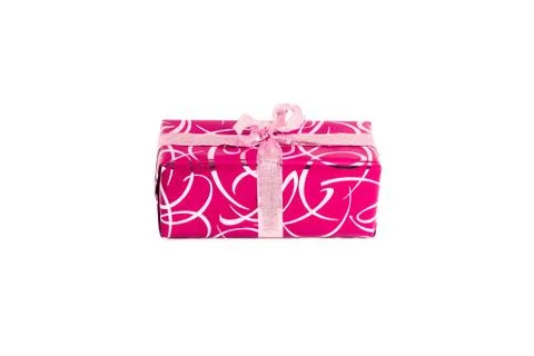 Packaged rectangular gift in pink packaging with gold bow and gold pattern on a Stock Photos