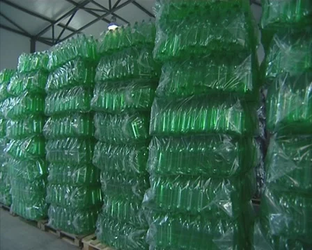 Packaged red and green PET bottles in warehouse. Stock Footage