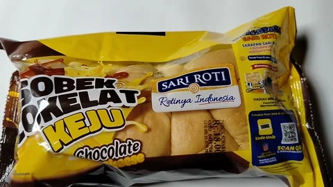 Packaged sweet bread product with chocolate and cheese flavor presented on  Stock Footage 339095920