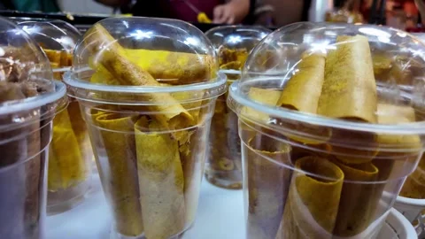 Packaged Thai Crispy Coconut Wafer Rolls in Takeaway Cups at Night Market Vídeos de archivo 340991491