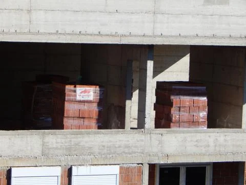 Packages of bricks to continue construction work on the building Stock Photos