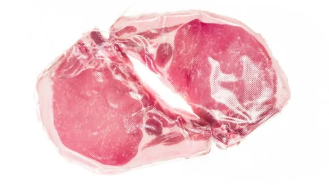 Packaging and Freezing Pportions of Fresh Meat 4K Stock Footage 328017406