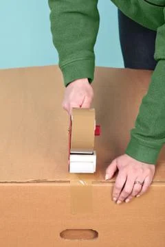 Packaging a box Stock Photos